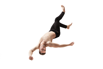 Image showing Mid-air beauty. Full length studio shot of attractive young man hovering in air and keeping eyes closed