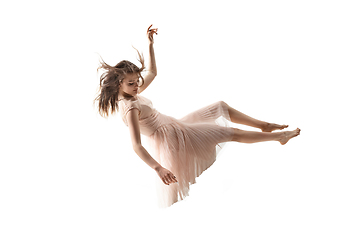 Image showing Mid-air beauty. Full length studio shot of attractive young woman hovering in air and keeping eyes closed