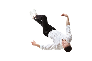 Image showing Mid-air beauty. Full length studio shot of attractive young man hovering in air and keeping eyes closed