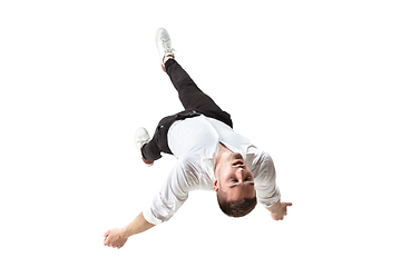 Image showing Mid-air beauty. Full length studio shot of attractive young man hovering in air and keeping eyes closed