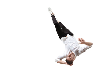 Image showing Mid-air beauty. Full length studio shot of attractive young man hovering in air and keeping eyes closed