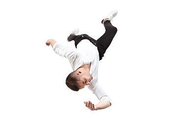 Image showing Mid-air beauty. Full length studio shot of attractive young man hovering in air and keeping eyes closed