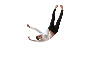 Image showing Mid-air beauty. Full length studio shot of attractive young man hovering in air and keeping eyes closed