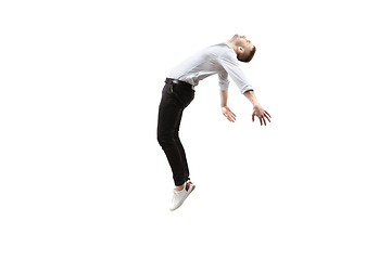 Image showing Mid-air beauty. Full length studio shot of attractive young man hovering in air and keeping eyes closed