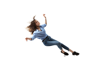 Image showing Mid-air beauty. Full length studio shot of attractive young woman hovering in air and keeping eyes closed