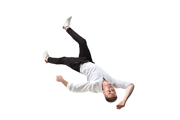 Image showing Mid-air beauty. Full length studio shot of attractive young man hovering in air and keeping eyes closed