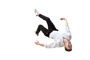 Image showing Mid-air beauty. Full length studio shot of attractive young man hovering in air and keeping eyes closed