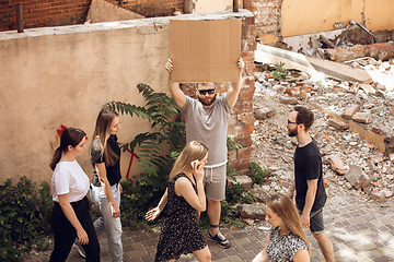 Image showing Dude with sign - man stands protesting things that annoy him