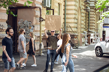 Image showing Dude with sign - man stands protesting things that annoy him