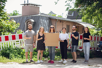 Image showing Dude with sign - woman stands protesting things that annoy her