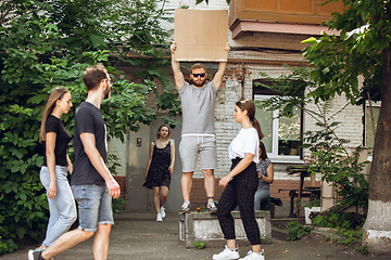 Image showing Dude with sign - man stands protesting things that annoy him