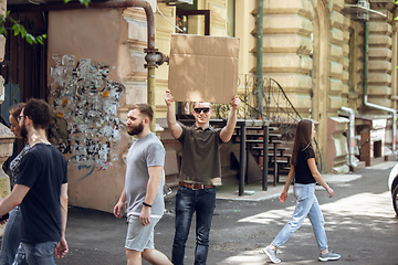 Image showing Dude with sign - man stands protesting things that annoy him