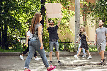 Image showing Dude with sign - man stands protesting things that annoy him