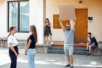 Image showing Dude with sign - man stands protesting things that annoy him