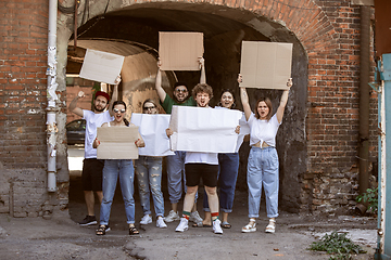 Image showing Diverse group of people protesting with blank signs. Protest against human rights, abuse of freedom, social issues