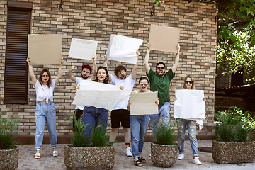 Image showing Diverse group of people protesting with blank signs. Protest against human rights, abuse of freedom, social issues