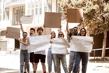 Image showing Diverse group of people protesting with blank signs. Protest against human rights, abuse of freedom, social issues