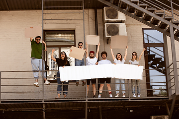 Image showing Diverse group of people protesting with blank signs. Protest against human rights, abuse of freedom, social issues