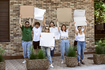 Image showing Diverse group of people protesting with blank signs. Protest against human rights, abuse of freedom, social issues