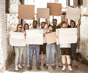 Image showing Diverse group of people protesting with blank signs. Protest against human rights, abuse of freedom, social issues