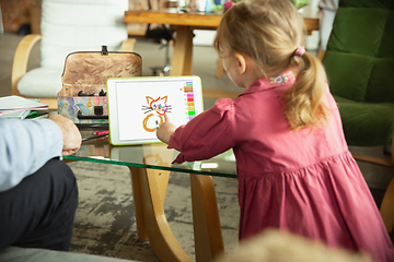 Image showing Grandfather and child playing together at home. Happiness, family, relathionship, education concept.