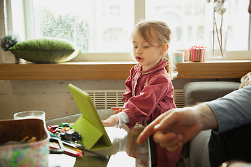 Image showing Grandfather and child playing together at home. Happiness, family, relathionship, education concept.