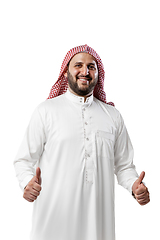 Image showing Smiling arabian man\'s portrait isolated on white studio background