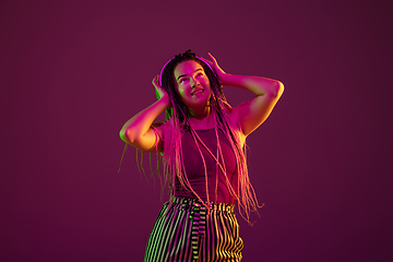 Image showing Portrait of young caucasian woman on pink background with copyspace, unusual and freaky appearance