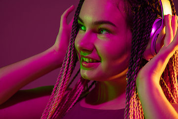 Image showing Portrait of young caucasian woman on pink background with copyspace, unusual and freaky appearance