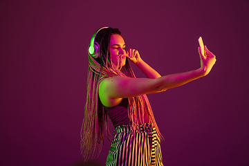 Image showing Portrait of young caucasian woman on pink background with copyspace, unusual and freaky appearance