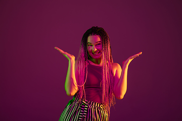 Image showing Portrait of young caucasian woman on pink background with copyspace, unusual and freaky appearance