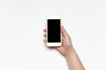 Image showing Close up of human hand using smartphone with blank black screen, education and business concept