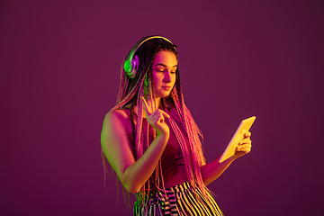 Image showing Portrait of young caucasian woman on pink background with copyspace, unusual and freaky appearance