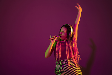 Image showing Portrait of young caucasian woman on pink background with copyspace, unusual and freaky appearance