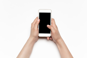 Image showing Close up of human hand using smartphone with blank black screen, education and business concept