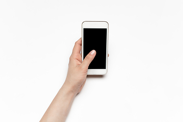 Image showing Close up of human hand using smartphone with blank black screen, education and business concept