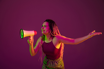 Image showing Portrait of young caucasian woman on pink background with copyspace, unusual and freaky appearance