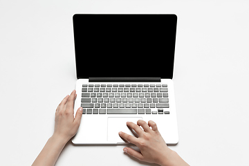 Image showing Close up of human hand using laptop with blank black screen, education and business concept