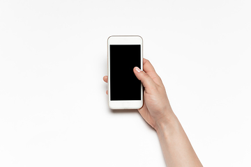 Image showing Close up of human hand using smartphone with blank black screen, education and business concept