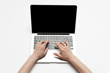 Image showing Close up of human hand using laptop with blank black screen, education and business concept