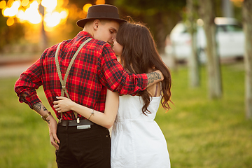 Image showing Caucasian young and happy couple enjoying a picnic in the park on summer day