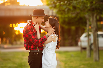 Image showing Caucasian young and happy couple enjoying a picnic in the park on summer day