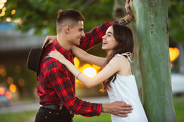 Image showing Caucasian young and happy couple enjoying a picnic in the park on summer day