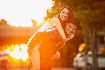 Image showing Caucasian young and happy couple enjoying a picnic in the park on summer day