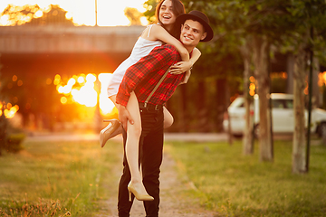 Image showing Caucasian young and happy couple enjoying a picnic in the park on summer day