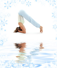 Image showing salamba sirsasana supported headstand on white sand