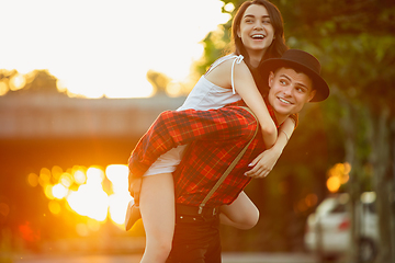 Image showing Caucasian young and happy couple enjoying a picnic in the park on summer day