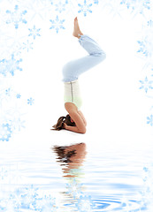 Image showing salamba sirsasana supported headstand on white sand