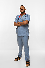 Image showing Beautiful african-american doctor smiling isolated over white studio background