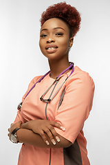 Image showing Beautiful african-american doctor or nurse smiling isolated over white studio background